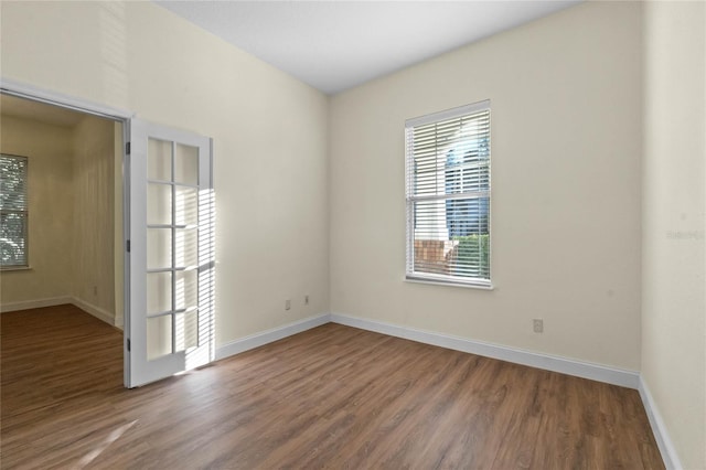 empty room with hardwood / wood-style floors