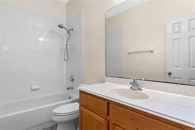 full bathroom featuring vanity,  shower combination, and toilet