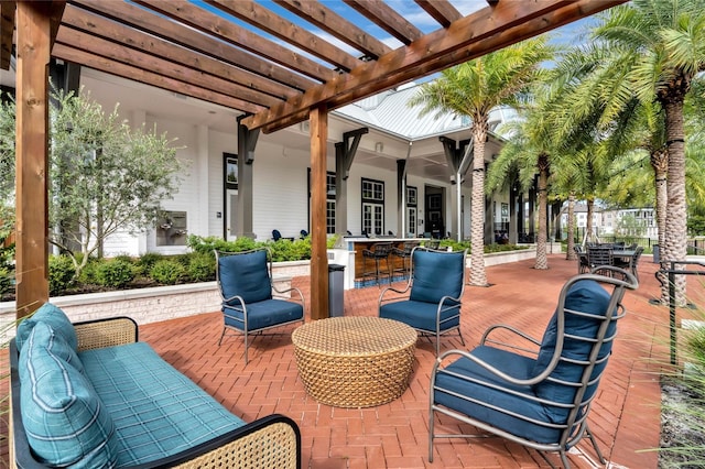 view of patio featuring a pergola, outdoor lounge area, and an outdoor bar