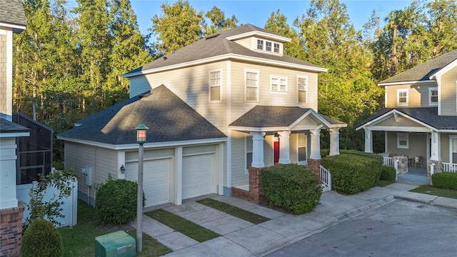 view of front of home with covered porch and a garage