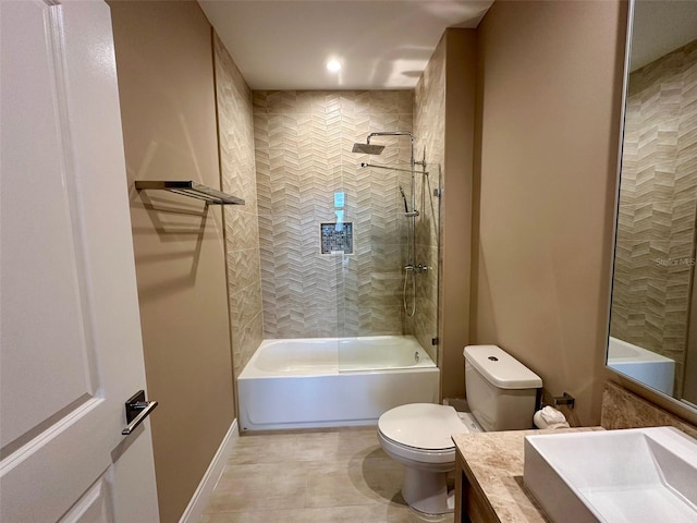 full bathroom with tile patterned floors, vanity, toilet, and tiled shower / bath