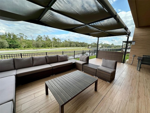 wooden terrace with outdoor lounge area