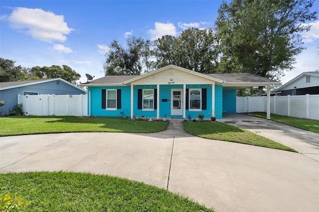 ranch-style house featuring a front lawn, a porch, and a carport