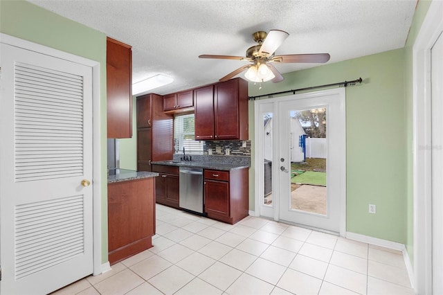 kitchen featuring backsplash, a textured ceiling, ceiling fan, light tile patterned floors, and dishwasher