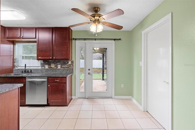 kitchen with ceiling fan, sink, stainless steel dishwasher, backsplash, and light tile patterned floors