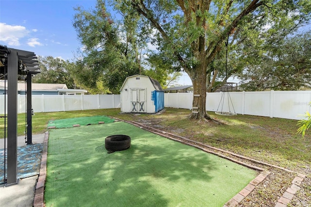 view of yard with a storage unit