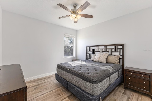 bedroom featuring ceiling fan and light hardwood / wood-style floors