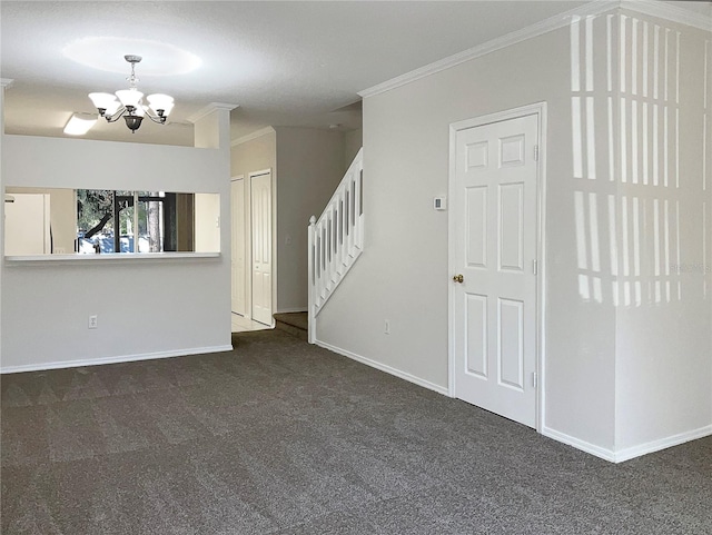 unfurnished living room with a chandelier, dark carpet, and ornamental molding