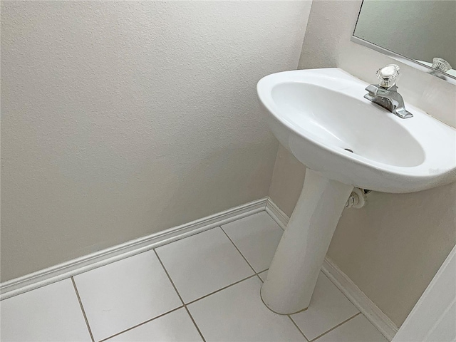 bathroom with tile patterned flooring