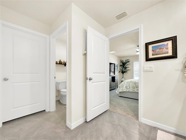 hallway with light carpet