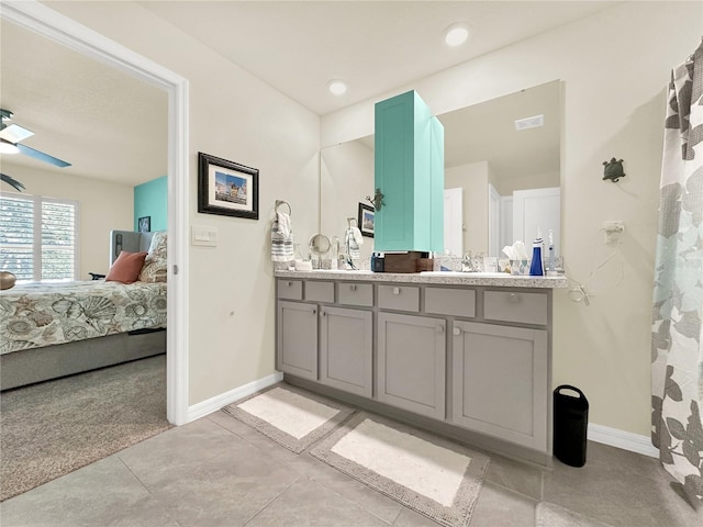 bathroom with ceiling fan and vanity