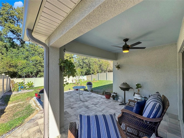 view of patio featuring ceiling fan