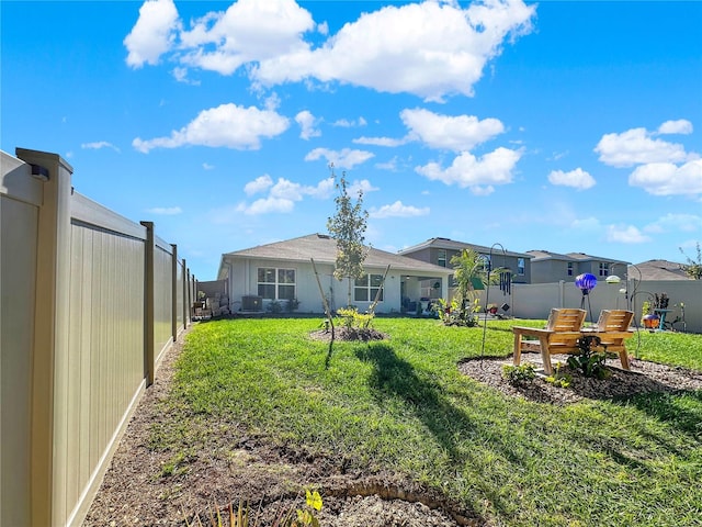 rear view of house with a lawn