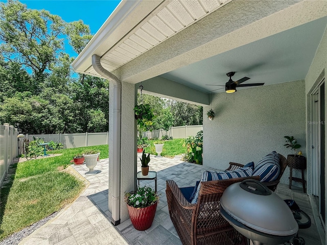 7729 Rosewood Garden Loop, Tampa, FL 33637 - fenced backyard featuring a patio and a ceiling fan