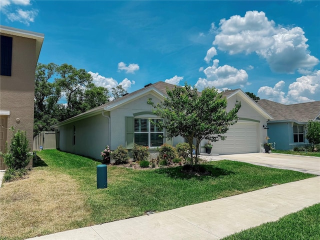 7729 Rosewood Garden Loop, Tampa, FL 33637 - single story home with a garage, concrete driveway, stucco siding, and a front yard