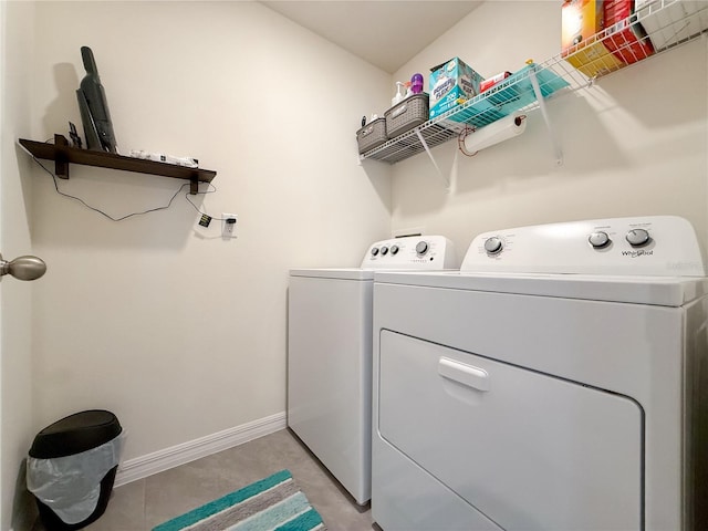7729 Rosewood Garden Loop, Tampa, FL 33637 - laundry area featuring washer and dryer and baseboards