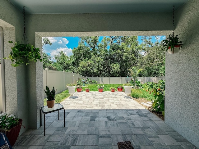 7729 Rosewood Garden Loop, Tampa, FL 33637 - fenced backyard with a patio area