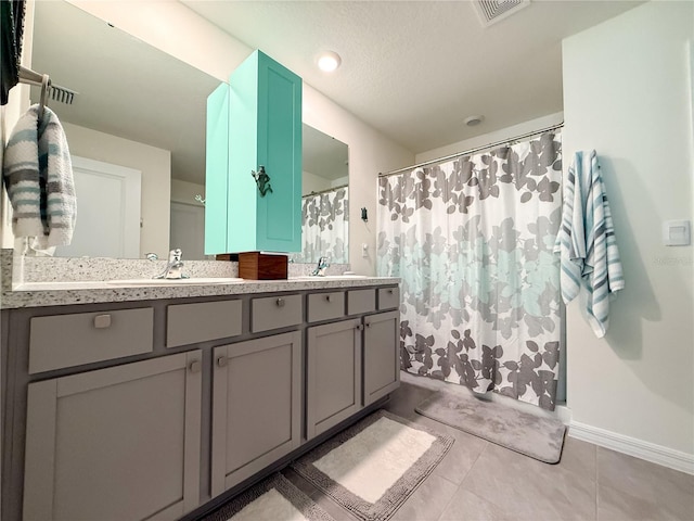 7729 Rosewood Garden Loop, Tampa, FL 33637 - bathroom with double vanity, curtained shower, and tile patterned flooring