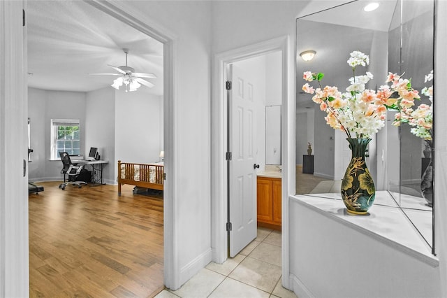 hallway with light tile patterned floors