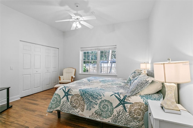 bedroom with hardwood / wood-style flooring, a closet, and ceiling fan