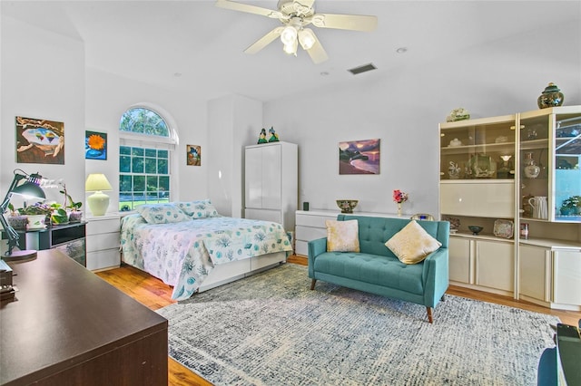 bedroom with wood-type flooring and ceiling fan