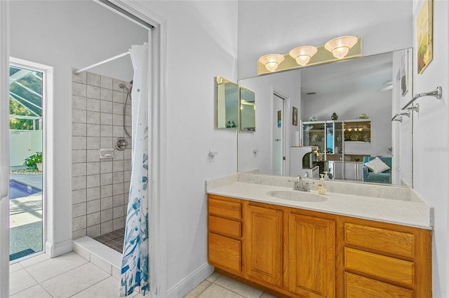 bathroom featuring tile patterned floors, a shower with curtain, and vanity