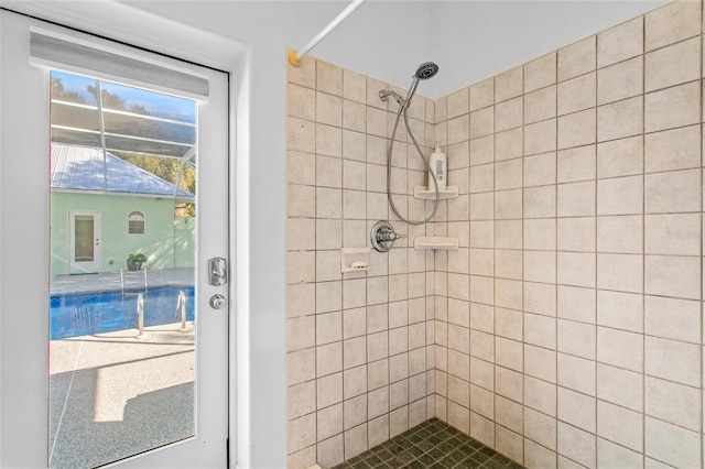 bathroom with tiled shower