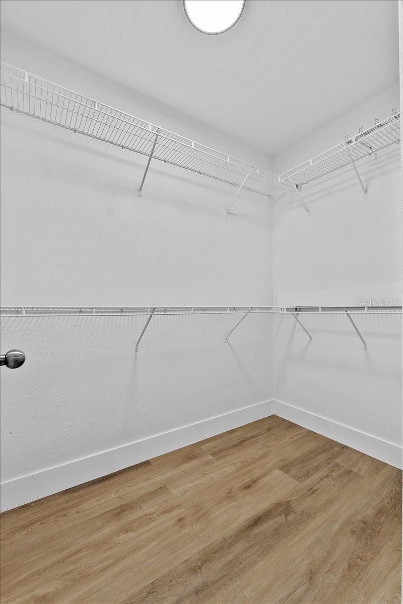 walk in closet featuring hardwood / wood-style flooring