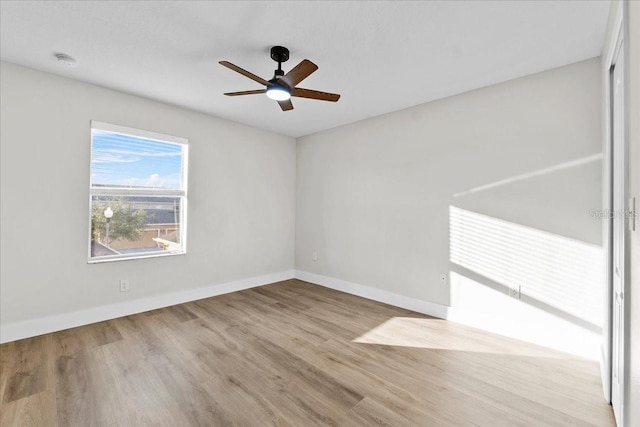 unfurnished room featuring ceiling fan and light hardwood / wood-style flooring