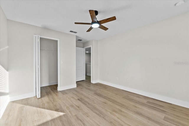 unfurnished bedroom with a closet, ceiling fan, and light hardwood / wood-style flooring