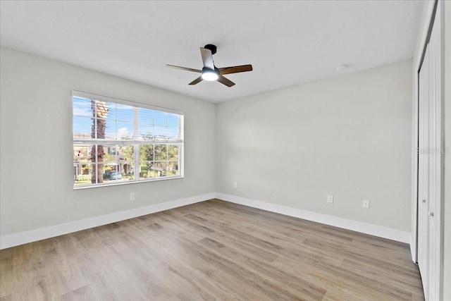 unfurnished bedroom featuring light wood-type flooring and ceiling fan