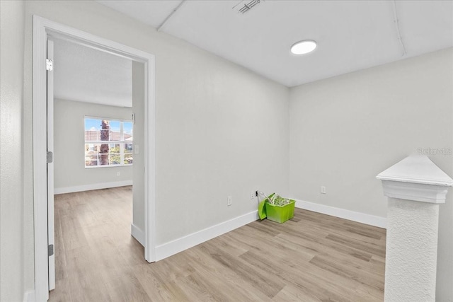 empty room with light wood-type flooring