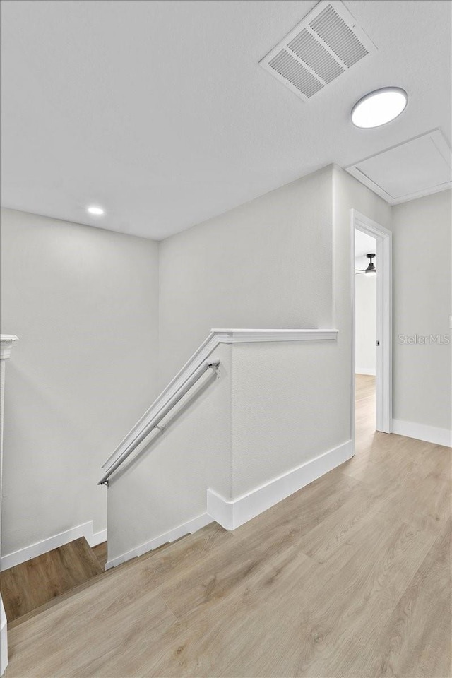 stairway featuring hardwood / wood-style floors