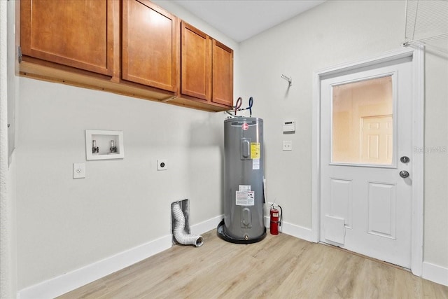 washroom featuring electric dryer hookup, cabinets, electric water heater, hookup for a washing machine, and light hardwood / wood-style floors