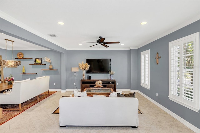 tiled living room featuring ceiling fan and ornamental molding