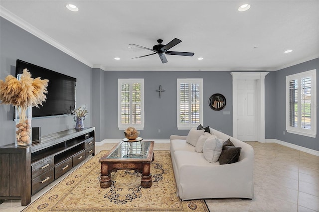 tiled living room with ceiling fan and crown molding