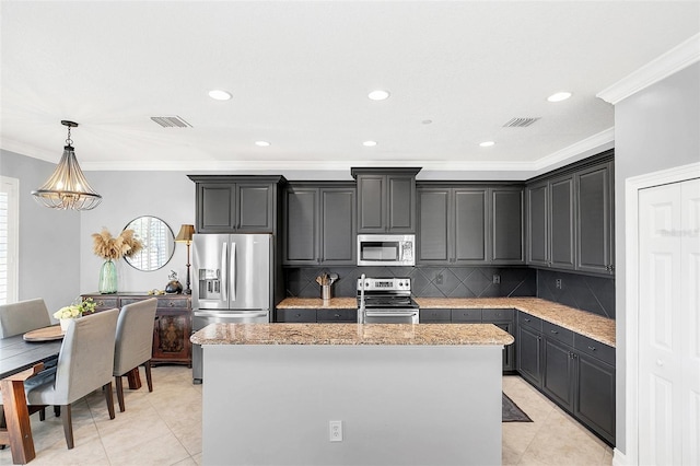 kitchen with light stone counters, stainless steel appliances, tasteful backsplash, a kitchen island with sink, and crown molding