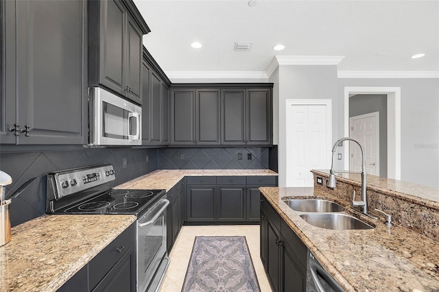 kitchen with sink, light stone counters, ornamental molding, decorative backsplash, and appliances with stainless steel finishes