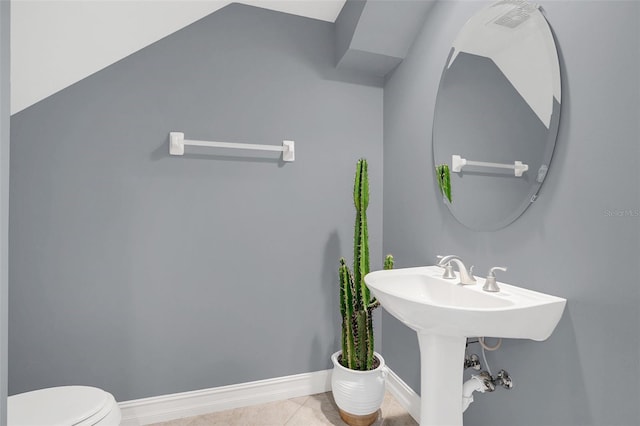 bathroom featuring toilet and tile patterned floors