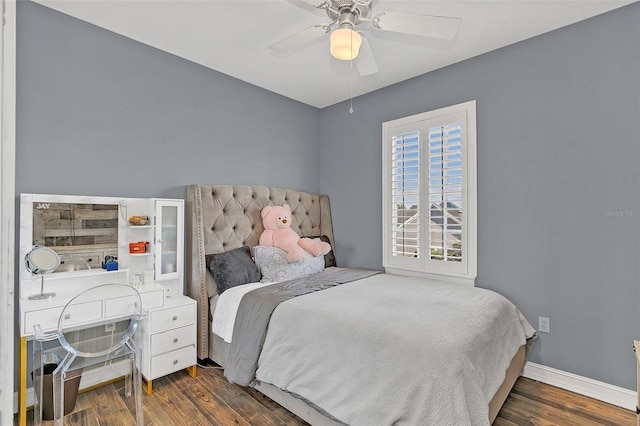 bedroom with ceiling fan and dark wood-type flooring