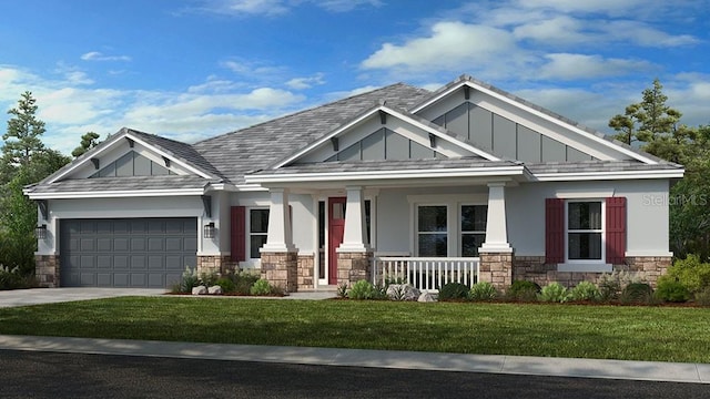 craftsman-style house featuring covered porch, a garage, and a front yard