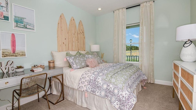 bedroom with light colored carpet