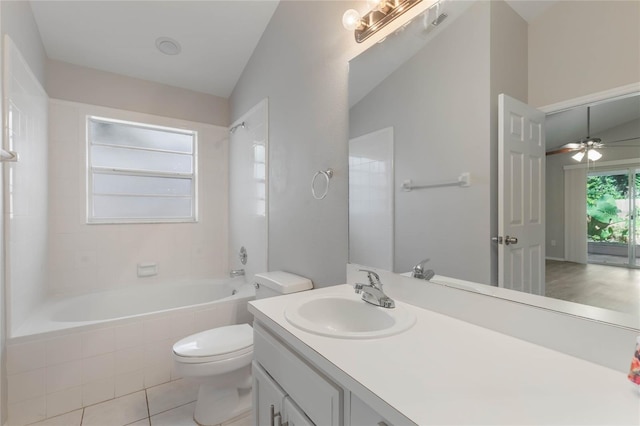 full bathroom featuring vanity, ceiling fan, tile patterned flooring, toilet, and lofted ceiling