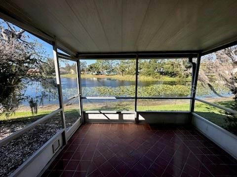 4518 Watch Hill Rd, Orlando, FL 32808 - unfurnished sunroom featuring a water view and healthy amount of natural light
