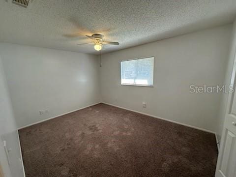4518 Watch Hill Rd, Orlando, FL 32808 - unfurnished room featuring ceiling fan, dark colored carpet, and a textured ceiling