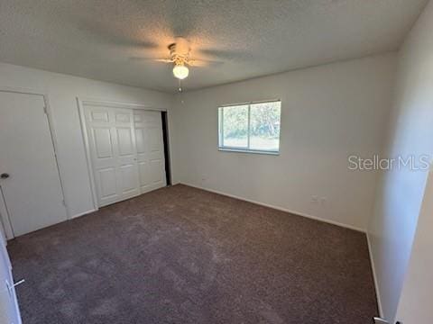 4518 Watch Hill Rd, Orlando, FL 32808 - unfurnished bedroom featuring carpet floors, a textured ceiling, and ceiling fan