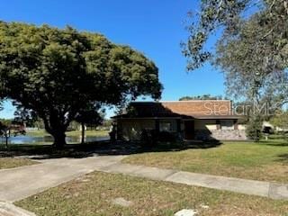 4518 Watch Hill Rd, Orlando, FL 32808 - single story home with a front yard