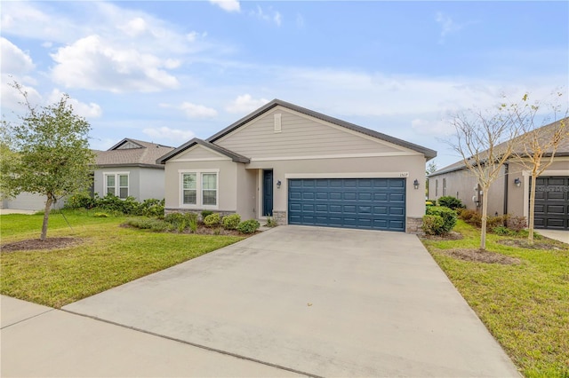 ranch-style home with a garage and a front yard