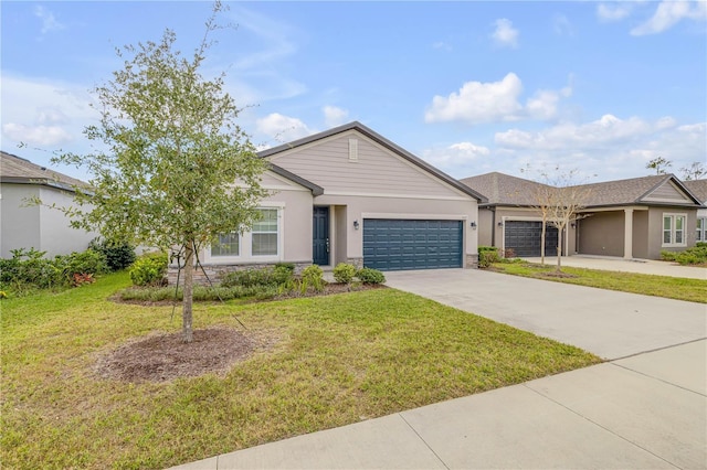 single story home with a front yard and a garage