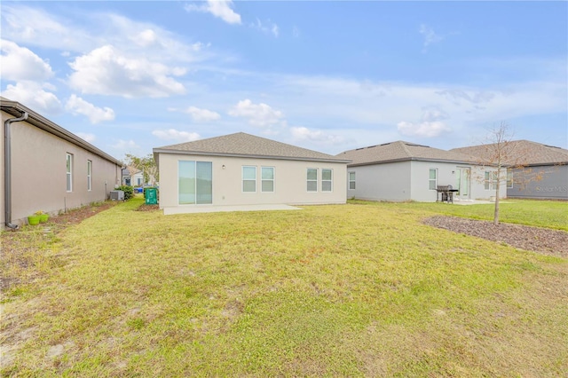 back of property with a lawn and cooling unit